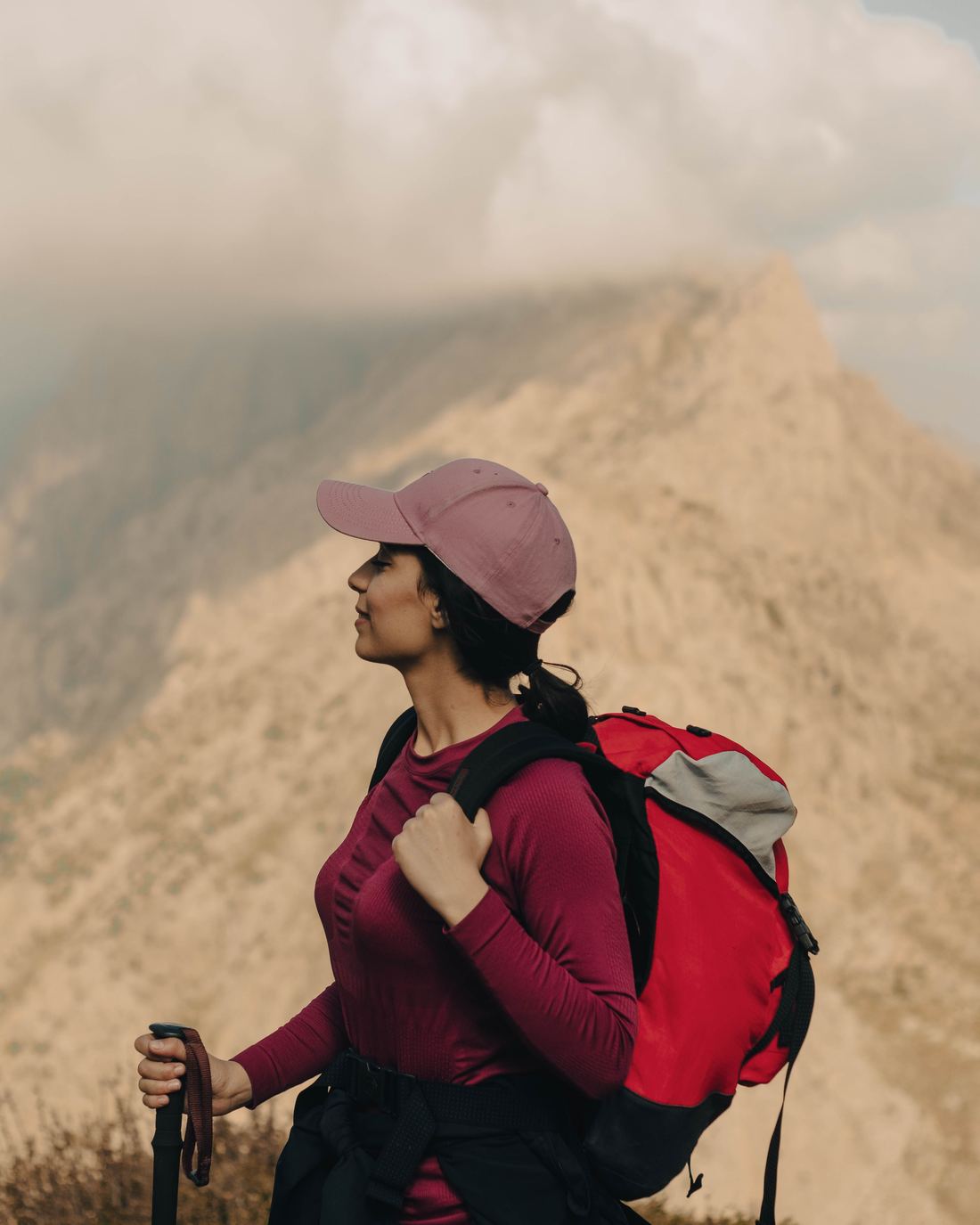 Woman hiking a mountain trail